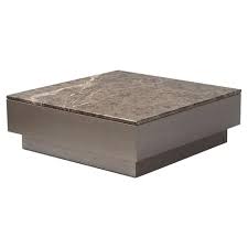 The dacia coffee table combines a brown faux marble with a brown finish to create a rich contemporary style that is perfect for any home décor. Adriana Hoyos Africa Modern Classic Brown Marble Top Wood Square Block Coffee Table 31 W 40 W Kathy Kuo Home