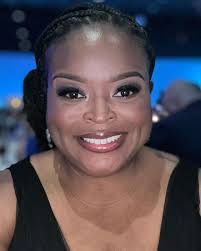 Can someone remove the shadow from my face in this photo?