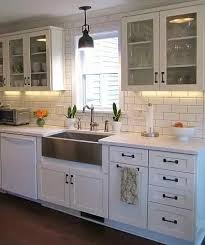 The most beautiful kitchen renovation in a 1905 black and white tile is a pretty classic look and i think you can pull it off with the kitchen you are describing. What Countertops Floors And Backsplashes Complement White Cabinets And Darker Handles Bronze Hardware Quora