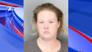 Woman charged with reckless homicide after man found dead inside home