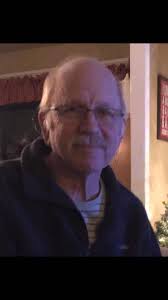 Carving a cartoon duck hunter and his Boykin spaniel