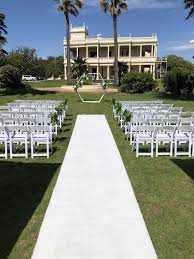 A tea length chiffon design is ideal, or you can even go for a plain short white dress. White Carpet Aisle Runner For Stylish Weddings In Melbourne Styled Event Hire