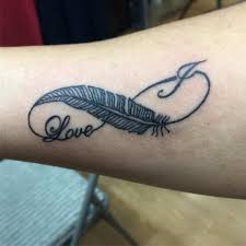 An infinity tattoo is a unisex symbol, but the design mentioned above is so brutal and right up for boys. 60 Beautiful Female Feather Tattoo Design Ideas 2021 Updated Saved Tattoo