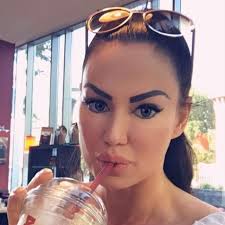 Priscilla Beaulieu, a 15-year-old American high school girl, photographed  with a photo of Elvis Presley at home in Wiesbaden, Germany in