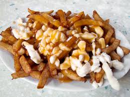 Poutine is probably one of the best known dishes from quebec. Poutine Montreal Quebec Local Food Guide