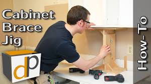 Hang Upper Cabinets By Yourself Cabinet Brace How To Installing Cabinets Cabinet Upper Cabinets