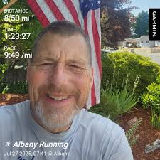 consecutive daily running streak of 1600 days with 4.97 mile average
