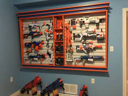 The gun holders are acoustic foam tiles, cut to fit and the shelves are lined with thick, tool box drawer liners (to prevent the guns from. Pin On Nerf