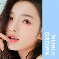 Kính áp tròng Noble Brown Blue Eyes, dòng lens cận sử dụng sáu tháng, giãn  tròng vừa, màu nâu cam NOB-BR