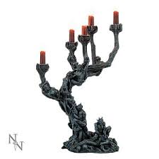 Black taper holders with white candles provide formal flair, while tea lights in metallic holders simplify the look. Vampires Kitchen Welcome To The Vampires Kitchen Your Uk Source For All Nemesis Now Gothic And Fantasy Candle Holders From Dragons To Demons Our Candelabra And Candle Holders Are Simply Amazing