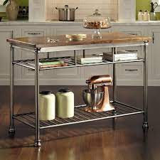 The roomy countertop and shelving offer an array of storage options, while two attached towel racks make cleaning up a breeze. Pin On Kitchen Island