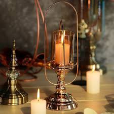 Why not experiment with our glass hurricane candle holders for a sleek and simple look? 17in Gold Metal Coiled Glass Hurricane Candle Holder Bulk Supply