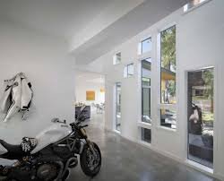 U shaped house plans) wrap around three sides of a patio or courtyard creating a sheltered area for entertaining or surrounding a key landscape element. Bold And Modern U Shaped Courtyard House Designed Around Trees