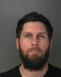 A Mastic Beach man was arrested after he brought explosive devices into  Stony Brook University Hospital and a subsequent search uncovered  additional devices at his home. A hospital security guard contacted Stony