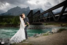 Canmore Outdoor Wedding Photos Bridal And Groom Wedding Photos Bride And Groom Outdoor Photos Outdoor Wedding Photos Wedding Photographers Wedding Gowns Lace