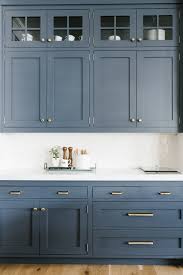It's a color that significantly departs from the typical white, gray or wood cabinet choices and yet is still versatile enough to work with the tones found in many common materials and finishes. Transitional Kitchen With Blue Gray Cabinets Town Country Living