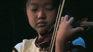 Teen Saxophonist performs Ku Ku with Chickens!