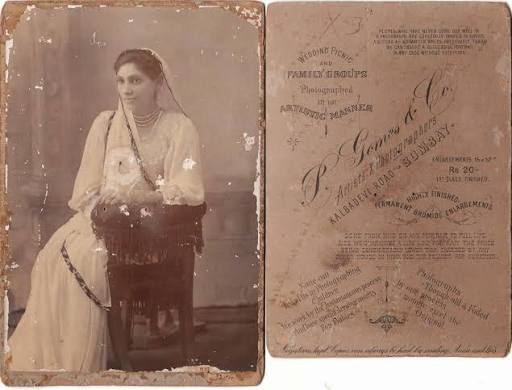 Mumbai, 1890s A beautifully preserved cabinet photograph of a Parsi woman from late 19th century Mumbai. Dressed in an elegant sari and adorned with pearls and jewellery, she represents a community that