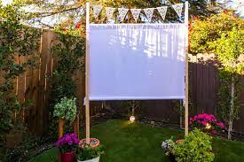 Loch and key productions borrow the shepherd's hooks from your hanging plants to use for the outdoor movie screen. How To Make An Easy Outdoor Movie Screen Hgtv