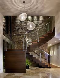 Extra High Ceilings Glass Stairwell Long Chandeliers Enters Into Great Room Modern Entry Staircase Design Modern Staircase