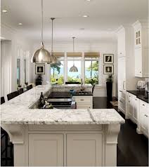 With an oversized kitchen island topped with a marble slab counter and breakfast bar seating this space provides plenty of room for socializing and entertaining. U Shape Island Traditional Kitchen Cabinet For Open Plan Kitchen White Shaker Style Buy White Shaker Kitchen Cabinet U Shape Island Traditional Kitchen Cabinet Product On Alibaba Com