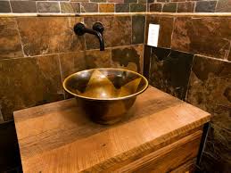 Often featuring a reclaimed finish, knotty wood and a basin or apron you can find rustic wooden bathroom vanities with a variety of base, mounting and sink styles. Rustic Bathroom Vanities Hgtv