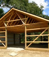 First, simply place the beams on the top of the posts and secure them using metal plates. Pole Barn Garage Design And Construction Ann Arbor Mi Chelsea Lumber Company