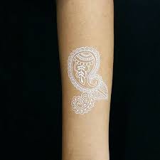 Sweet and simple white ink tattoo on a tanned skin. White Tattoos For Women And Men Discover Ideas