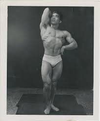 Photo Of Tommy Kono Posing The Index