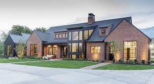 White painted brick georgian colonial house with american flag on an overcast day. 47 Brick Exterior W Black Windows Ideas In 2021 Brick Exterior Brick House Exterior