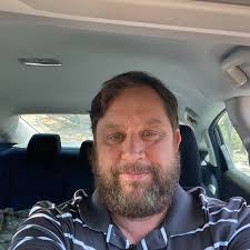 Who can mow 2 acres of high grass in Rockdale, TX?