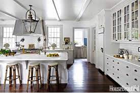 With a makeshift kitchen island that provides extra work space and storage, fresh white paint, and more task lighting instead of a retro ceiling fan, it's good to go. Beautiful White Kitchens House Of Hargrove