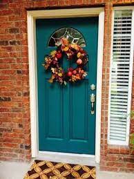 Reflecting the sky above, this blue front door lends a happy hue to this home. Image Result For House Exterior Colors That Go With Orange Brick Painted Front Doors Front Door Paint Colors Exterior House Colors