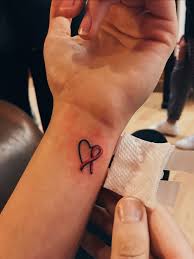 But survivors do as well. Small Breast Cancer Tattoo