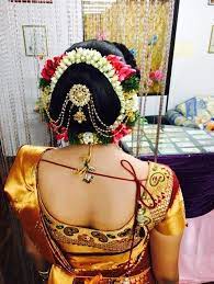 What A Beautiful Large Low Bun With Real Flower Gajra Juda Pin Care However Should Be Taken Before Adopting Suc Bridal Hair Buns Bridal Bun Bride Hairstyles
