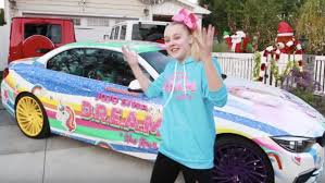 With her gigantic face spread across the bonnet and d.r.e.a.m. The Truth About Jojo Siwa S Cars