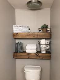 we built these chunky wood shelves in our bathroom i love them shelves floating shelves bathroom bathroom wood shelves