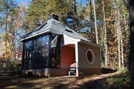 Cedar raised garden beds, polycarbonate roofing, automated vents, and passive heating / cooling system. Jeff S Cabin Greenhouse Tinyhousedesign