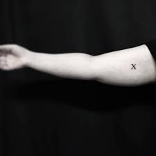 Browse tattoo ideas in all styles from tribal, japanese, watercolor and more. X Letter Tattoo On The Inner Arm