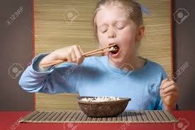 Little Girl In Blue Eating Rice With Chopsticks Stock Photo Picture And Royalty Free Image Image 3317207