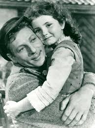 Noreen Corcoran gets a big hug from Danny Kaye, playing Hans Christian  Andersen in the 1952 movie. Noreen was 9 when the movie was made, and her  small part was uncredited. A