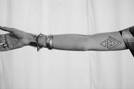 Simple black circle tattoo on the arm. Geometrics Arms Tattoos