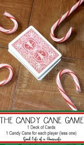 Create a hopping game in which participants must hop through a hopscotch board, or from a starting line to a finish line, without dropping any candy canes. The Candy Cane Game