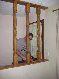 So Our Home Has The True Mark Of A 1970 S House Spindles By The Entrance This Pic Was Taken After We Took Half Wall Room Divider Pony Wall Updating House