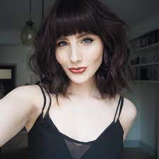 This hairstyle has the bob cut and the forehead is capped with front fringe that supplements to the cuteness of the whole look. Dark Brown Bob Hair With Fringe Novocom Top