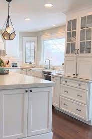 Finally the cost can be further complicated by the outer layers of the plywood. This Timeless White Kitchen Features An Abundance Of Stylish Storage From The Island End Caps To The Wide Drawer White Cabinets White Kitchen Cabinets Cabinet
