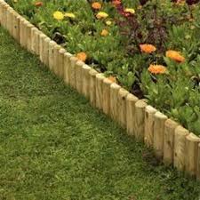 Something that anybody can do and have great results, and at the same time time is different and unique from all the ston. Hugedomains Com Timber Garden Edging Wood Landscape Edging Wooded Landscaping
