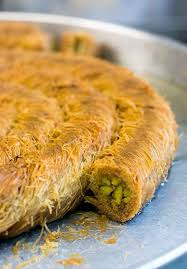 Middle eastern kunafeh topped with pistachios. Mansoura Middle Eastern Desserts Middle Eastern Recipes Turkish Recipes