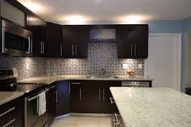 Granite as a backsplash when combined with granite as a countertop is sometimes seen and being a little bit controversial as it can be seen as too much granite. Backsplash Granite Kitchen Studio