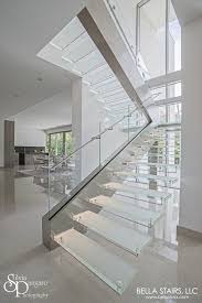 This Floating Glass Staircase Features Frosted Treads With Led Lighting Starphire Glass Railings And Com Glass Staircase Glass Staircase Railing Glass Stairs